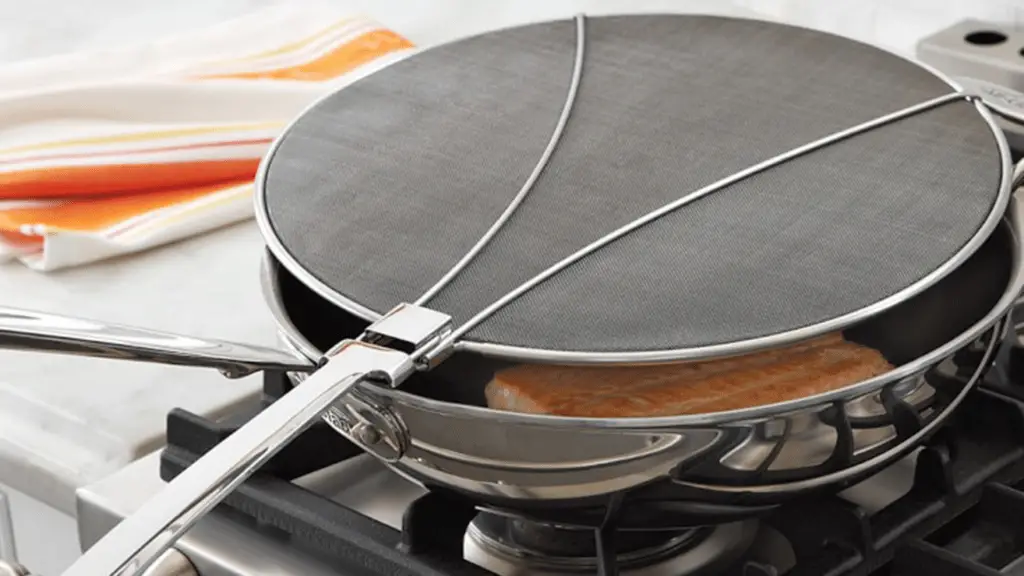Use charcoal filter splatter screen to prevent smell in small kitchen